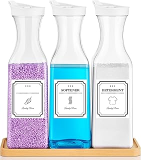 Clear laundry detergent dispenser bottles on a bamboo tray